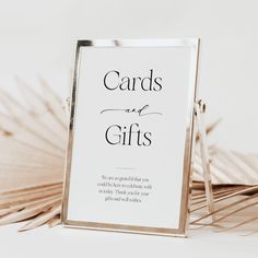 a sign that says cards and gifts with palm fronds in the foreground