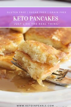 keto pancakes on a white plate with syrup and a fork in the foreground