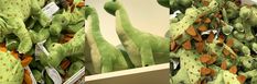 the stuffed dinosaurs are all green and brown