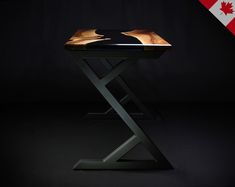 a black table with a maple leaf on it and a canadian flag in the background