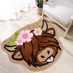 a brown cow rug with flowers on it