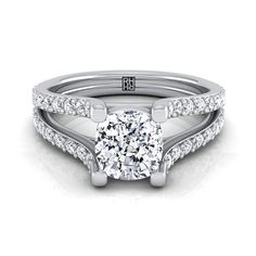 a white gold engagement ring set with a round diamond