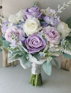 a bouquet of flowers sitting on top of a chair