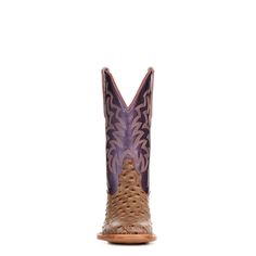 Elevate your western wardrobe with Cavender's Women's Sand Ostrich Print and Metallic Purple Cowboy Boots. Designed for the modern cowgirl with a flair for the dramatic, these boots feature a striking sand ostrich print combined with a vibrant metallic purple upper that commands attention. Standing 11 inches tall, they showcase a wide square toe for added comfort and style. The leather-covered cushioned insole ensures all-day wearability, while the leather outsole, reinforced with a double-stitched Goodyear welt, provides durability and support. The western heel adds a classic touch, and the convenient pull-on design, enhanced by pull straps, makes them easy to wear. Each pair is crafted with meticulous attention to detail, making them a distinctive addition to any collection. Available ex Purple Cowgirl Boots, Purple Cowgirl, Purple Cowboy Boots, Western Wardrobe, Square Toe Cowboy Boots, Buckaroo Boots, Alligator Boots, Modern Cowgirl, Cowboy Boots Square Toe