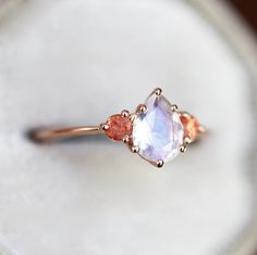 Beautiful pear moonstone and sunstone ring, price is for pear ring only. Can be made with other stones as well. Product info: 14k solid gold pear sunstone 7x5mm approx 3mm sunstones For sizes larger than 8 please contact me before purchase. Ring will be shipped with Express shipping. Please visit my shop here: https://www.etsy.com/shop/threelayers Fine Jewelry Pear-shaped Moonstone Ring, Elegant Pear-shaped Moonstone Ring, Pear-shaped Moonstone Wedding Ring, Fine Jewelry Teardrop Moonstone Wedding Ring, Teardrop Moonstone Wedding Ring Fine Jewelry, Teardrop Moonstone Wedding Ring In Fine Jewelry Style, Teardrop Moonstone Ring For Wedding, Wedding Fine Jewelry Teardrop Moonstone Ring, Elegant Three-stone Moonstone Ring For Gift