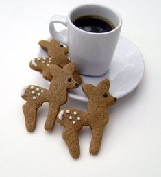 some cookies are next to a cup of coffee