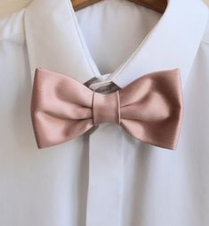 Handmade usty pink satin bow tie.  Size of the bow - Width: 6 cm / 2,36 inches - Length: 12 cm / 4,72 inches The adjustable strap takes it to 21" in length, making it a great accessory that can be adjusted for comfort and fit or given as a gift if you are unsure of neck size. Perfect for formal or causal use. **bowties are in a clear cellophane bag, perfect for gift giving and shipped in a small white shipping box to keep them from being damaged** Classic Wedding Ties With Decorative Bow, Classic Wedding Tie With Decorative Bow, Classic Pink Bow Tie For Party, Classic Decorative Bow For Wedding, Classic Wedding Bow With Decorative Bow, Elegant Pink Bow Tie For Black Tie Events, Elegant Pink Bow Tie For Suits, Pink Formal Bow With Bow Tie Back, Classic Pink Bow For Formal Occasions