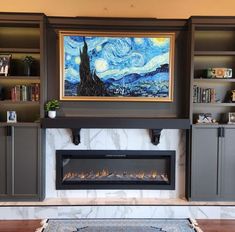 a living room filled with furniture and a fire place in front of a painting on the wall