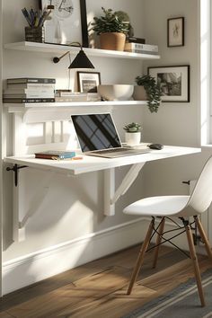 a laptop computer sitting on top of a white desk in front of a book shelf