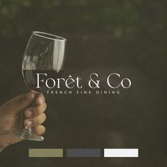 a person holding a wine glass with the words fortet & co in front of them