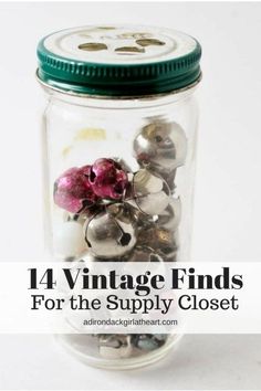 a glass jar filled with lots of different types of buttons and other things in it