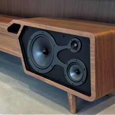 a wooden bench with speakers on it