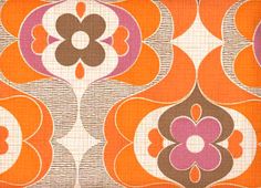 an orange and brown pattern on fabric