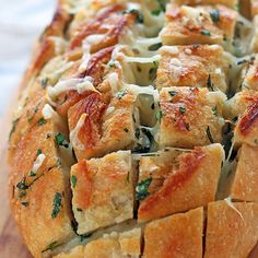 the bread has cheese and herbs on it