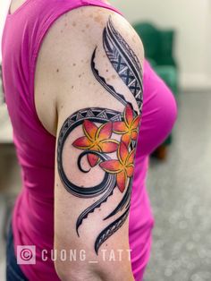 a woman with a tattoo on her arm