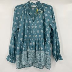 Roller Rabbit Women's Tashi Border Jannella Top - New With Tags Color: Teal Blue/White Size: Small Retail: $148 Tunic Blouse Split, V-Neckline Drawstring Tassel Detail At Neck Long Blousson Sleeve Ruffled Cuff Cinched Waist Tashi Border Print Relaxed Fit 100% Cotton 19.5" Pit-To-Pit 25.5" Long Light Blue Long Sleeve Bohemian Blouse, Light Blue Bohemian Blouse With Floral Print, Blue Tunic Tops For Fall, Bohemian Light Blue Floral Print Blouse, Blue Flowy Cotton Blouse, Blue Long Sleeve Blouse With Boho Print, Flowy Blue Cotton Blouse, Bohemian Turquoise Long Sleeve Blouse, Light Blue Bohemian Top For Fall