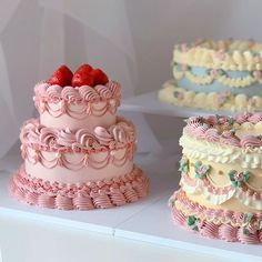 three different types of cakes are on display