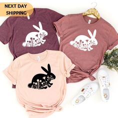 "Floral Bunny Shirt, Easter Shirt, Cute Bunny T Shirt, Rabbit Shirt, Bunny Lover Shirt, Bunny Mom, Bunny Lover Gift, Easter Kids Shirt Hi there! I'm Daisy, the owner of DaisyTeeUS. I'm so glad to see you here. My priority is to make you happy with your purchase. Please contact me if you have any questions or want to get a custom-made design. If you liked the design but didn't like the shirt color we have, please choose another t-shirt color in the color chart. You can also change the color of th Happy Bunny Shirt, Cute Bunny Design Short Sleeve T-shirt, Cute Bunny Design T-shirt For Spring, Cotton T-shirt With Bunny Print For Spring, Bunny T Shirt, Mom Of Boys Shirt, Spring Cotton T-shirt With Bunny Design, Bunny Mom, Bunny Shirt