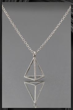 The sterling silver necklace has two kinds of finishing. The exquisite necklace is suitable for any occasion. Finishing options: Vermiel (silver with gold plating) pyramid with gold-filled chain Sterling silver pyramid with sterling silver chain Pendant size: 0.5''L, 0.4''W Adjustable Chain: 16'', 17'' Pyramid Necklace, Triangular Prism, Silver Chain Pendant, Triangle Necklace, Chain Pendant, Fun Earrings, Earrings Collection, Gold Filled Chain, Silver Pendant Necklace