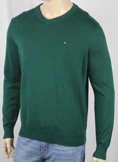 Tommy Hilfiger Green V Neck Cotton Long Sleeve Sweater NWT ~*~*Tommy Hilfiger*~*~ ~*~*New With Tags*~*~ This gorgeous crew neck sweater is by Tommy Hilfiger. In a fabulous Green 100% cotton, this sweater features a handsome v neck neckline. The sleeves are long and have ribbed cuffs. A Tommy Hilfiger Logo is embroidered on the chest,  and finishes this sweater off quite nicely.   Small Medium Large X-Large XX-Large ARMPIT TO ARMPIT 20.5" (52.1 cm) 22” (55.9 cm) 23.5” (59.7 cm) 25” (63.5 cm) 27” Casual Solid Color Crew Neck Sweater, Solid Crew Neck Stretch Sweater, Solid Stretch Crew Neck Sweater, Green Crew Neck Sweater For Winter, Classic Crew Neck Winter Tops, Classic Winter Crew Neck Tops, Tommy Hilfiger Crew Neck Winter Sweatshirt, Green Stretch Crew Neck Sweater, Spring Crew Neck Sweater