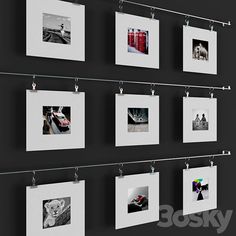 multiple pictures hanging on a wall with clothes pins