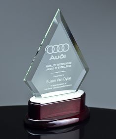 an award is placed on a black table