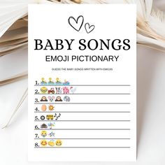 a baby song book with emoj dictionary written on it