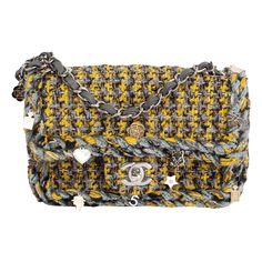 100% authentic Chanel 2017 Charms Tweed Small Flap shoulder bag in chartreuse, grey and black tweed fabric with a braided trim that is embellished with beige-gold and silver-tone charms. The bag features a silver-tone CC turn-lock and chain shoulder strap. Brand new. Plastic cover still on hardware. Comes with dust bag. Measurements Height 14cm (5.5in) Width 19cm (7.4in) Depth 7cm (2.7in) Drop of the Handle 58cm (22.6in) Shoulder Strap Length 121cm (47.2in) Hardware Silver-Tone Blindstamp 24680251 All our listings include only the listed item unless otherwise specified in the description above. Braid Charms, Chanel 2017, Woven Jewelry, Tweed Bag, Braid Jewelry, Yellow Jewelry, Classic Flap Bag, Flap Shoulder Bag, Jewelry Pendants