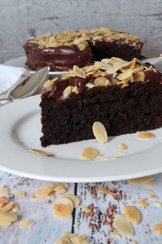 a piece of chocolate cake on a white plate