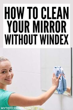 a woman cleaning her mirror with a cloth