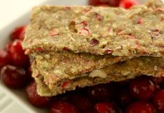 two crackers sitting on top of cherries in a bowl