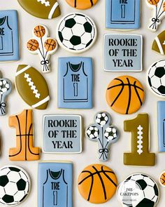 decorated cookies are arranged in the shape of sports balls and basketballs for one year