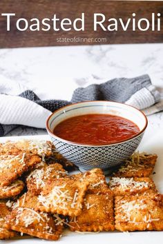 toasted ravioli with marinara sauce and parmesan cheese on the side