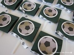 soccer themed place cards are displayed on a table with white and green paper streamers