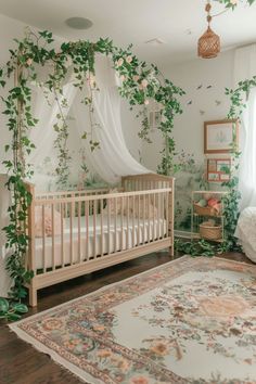 a baby's room decorated with greenery and hanging lights, including a crib