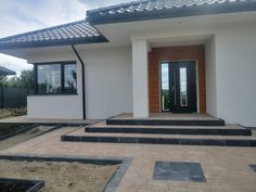 a house with steps leading to the front door