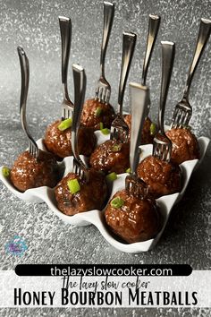 there are some meatballs with forks stuck in them on a plate and the title says honey bourbon meatballs