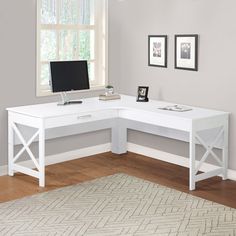 a white corner desk with a computer on it