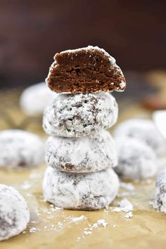 a stack of cookies with powdered sugar on top