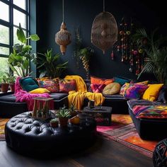 a living room filled with lots of colorful furniture and plants on top of the couches