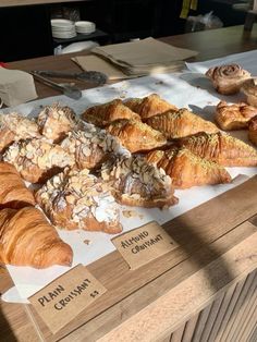 there are many different types of pastries on the counter