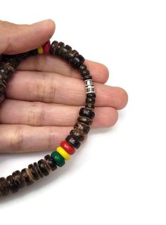 "Rasta Necklace. Wooden Necklace. Unique exotic design. Handmade with rasta color wooden beads and cord. Unisex Design. Long Necklace. 23\" Inches Around the neck FAST & FREE SHIPPING! *First Class Mail Visit my Etsy Shop to see more Designs! Handmade Rasta Wooden Earrings, Rasta Bracelets and Necklaces. Click here to see more designs: https://www.etsy.com/shop/FreedomLifeStyle" Handmade Wooden Jewelry For Meditation, Spiritual Wooden Beads Necklace, Spiritual Wooden Bead Necklace, Spiritual Necklace With Wooden Beads, Multicolor Wooden Jewelry As A Gift, Ebony Jewelry With Wooden Beads For Gifts, Ebony Jewelry With Wooden Beads As A Gift, Multicolor Wooden Jewelry Gift, Rasta Necklace