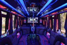 the inside of a party bus with couches and tables