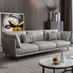 a living room filled with furniture and a large painting on the wall above the couch