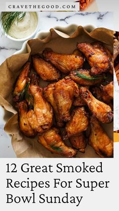 some chicken wings and carrots on a plate with the words 12 great smoked recipes for super bowl sunday