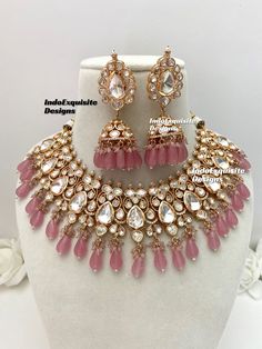 Tyaani inspired Premium Quality uncut Polki Kundan Necklace set comes with Jhumki Earrings/pink/uncut Polki/ Bridal sets/Reception/Wedding/bridal jewelry/ Indian jewelry /Kundan Jewelry/uncut kundan polki necklace All items are shipped from Brampton, Ontario, Canada. If you need your item by a certain day, please reach out to us for express delivery option before placing the order so that we can update the shipping for you before you place the order. Standard shipping/delivery timeline Below are the estimated delivery times once the order is shipped/dispatched.  ---> USA delivery timeline * 4-8 business days to major urban centers in USA. It may take 2-3 days extra to remote locations ---> Canada delivery timeline  * 2-3 business days - GTA  & Montreal  * 2-4  business days - Rest of Ontar Pink Temple Jewelry Necklace With Latkans, Pink Round Kundan Necklace For Diwali, Pink Jewelry With Matching Earrings For Festivals, Pink Kundan Necklace With Latkans As A Gift, Pink Kundan Necklace With Latkans For Gifts, Pink Kundan Necklace For Festivals, Pink Bollywood Necklace With Hand Set, Pink Round Jewelry Sets For Diwali, Festive Pink Necklace With Latkans