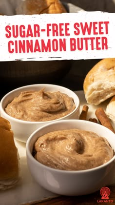 two white bowls filled with cinnamon butter sitting on top of a table next to rolls