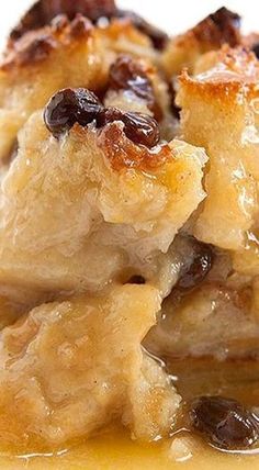 a close up of food on a plate with sauce in the middle and raisins all over it