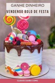 a birthday cake decorated with candies and lollipops