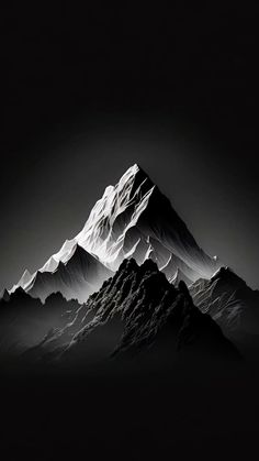 a black and white photo of a mountain range with snow on the top, taken at night